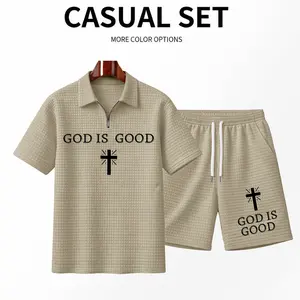 Men's "God Is Good" Printed Cross Pattern Zip-Up Short-Sleeved Polo Shirt And Shorts Set, Made Of Solid-Colored Textured Fabric, Breathable And Comfortable, Featuring A Classic Zip-Up Collar Design. A Stylish And Casual Everyday Outfit.