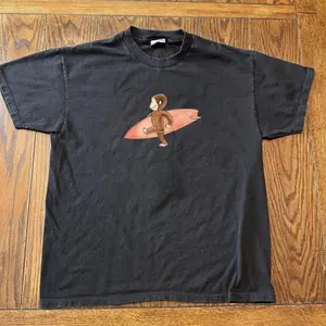 [100% Cotton][Graphic Tee]Curious Georgee Surfing Graphic T-Shirt – Black  Tee, Cute Cartoon Monkey Shirt, Unisex Casual Streetwear Top, unisex shirt, gift for her for him