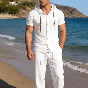 The top trending mens summer set on TikTok right now. White hooded short sleeve button up shirt with matching drawstring pants. Versatile comfortable and endlessly stylish for every warm weather occasion. Elevate your vacation wardrobe with this must have
