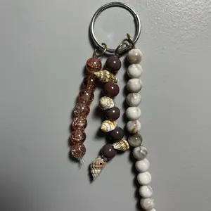 Brown keychain with seashells