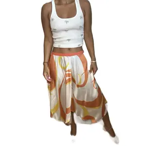 Vintage y2K Bebe Silk Low Rise Midi Skirt Medium with Orange and Yellow Patterned Design