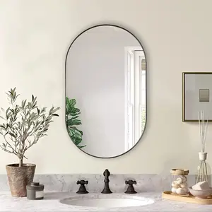 Black 20×33-inch metal oval mirror, classic style, features an aluminum alloy frame and 4mm high-definition glass, perfect for modern home decor.