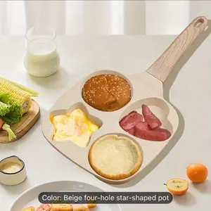 One Beige Four-Hole Starheart Frying Pan. This Non-Stick Egg Frying Pan Is Perfect for Quickly Preparing Breakfast in The Kitchen Or Restaurant