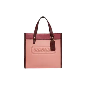 COACH Field 22 Badge-Embellished Vertical Sheet Music Leather Tote Bag for Women, Strawberry Red and Sakura Pink
