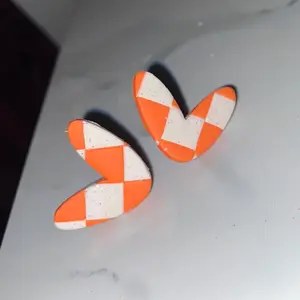 Checkerboard stud earrings.