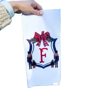 Navy Nutcracker Crest Tea Towel with Festive Bow and Christmas Tree Design for Holiday Decor