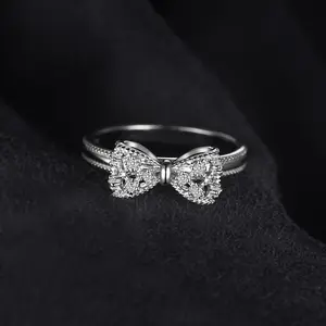 A vintage-inspired jewelry set featuring a micro-pavé-set lab-grown diamond engagement ring in sterling silver with zirconia, perfect for everyday wear-stunning, stylish, and charming. 5-piece set.