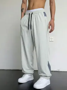 1-pack men’s ice silk quick-dry jogger pants with color-block design, drawstring elastic waistband, breathable drape that feels cool and prevents overheating—ideal for everyday summer commuting outfits.