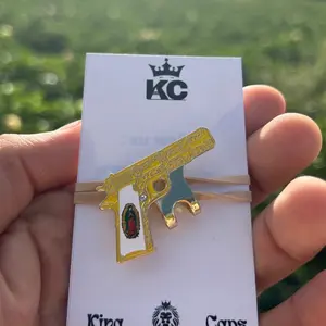 Super Gun hat pin