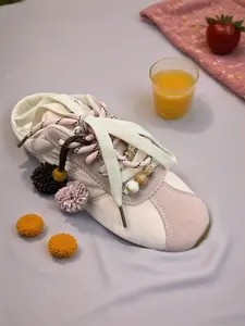 Neutral pink Lace-Up Women's Sneaker with Decorative Tassel Accents Closed Toe Casual Shoe
