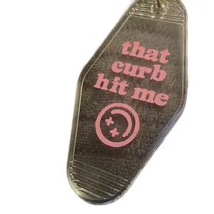 "That Curb Hit Me" Motel Keychain - Unique Design with Pink Text and Smiley Face Symbol