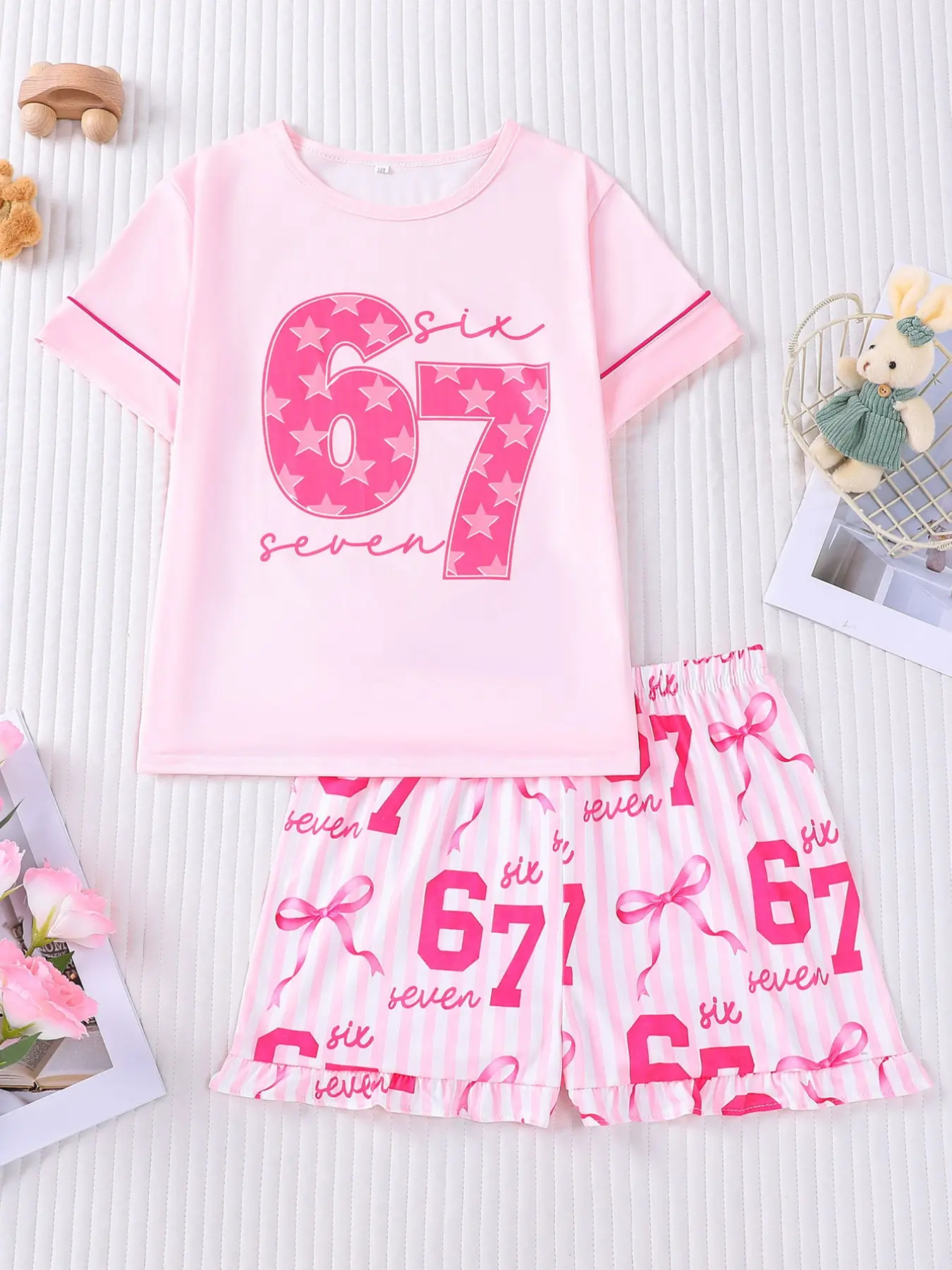 Pink Striped Six Seven 67 Themed Kids Pajamas 2-Piece Set, Summer Sleepwear Set, New Flame-Resistant Round-Neck Short Sleeve Top with Elastic Waist and Ruffled Shorts, Pink and White Striped with Bow Print Design