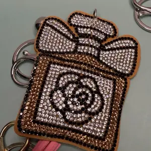 Gold perfume bottle keychain