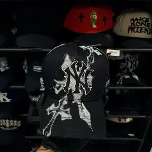 Rude Awakenings 1:1 Black Baseball Cap with White Logo and Cross Design Hand-Painted Splatter Effect Streetwear Edge Distressed Brim