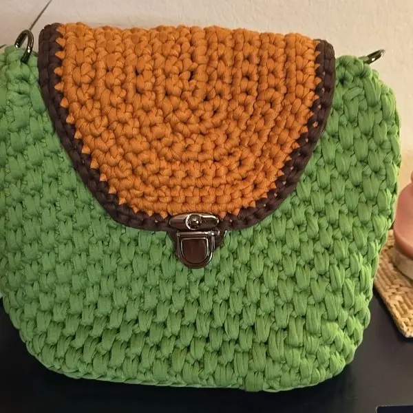 by Mimi Bucket Crochet Backpack in Orange, Brown, and Green