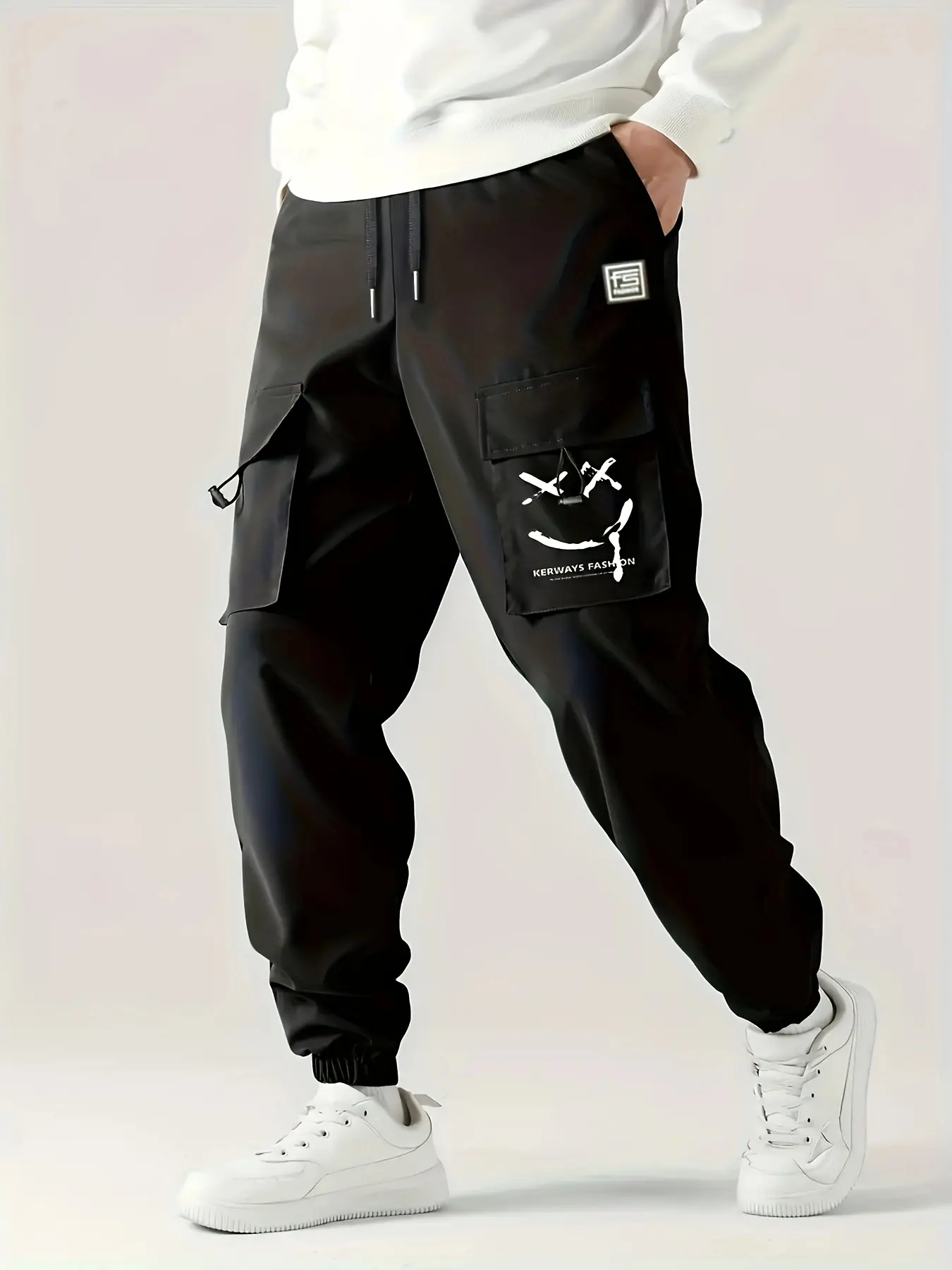 Men’s cargo jogger pants with smiley face print, multiple pockets, elastic drawstring waist, cuffed ankles—streetwear trousers