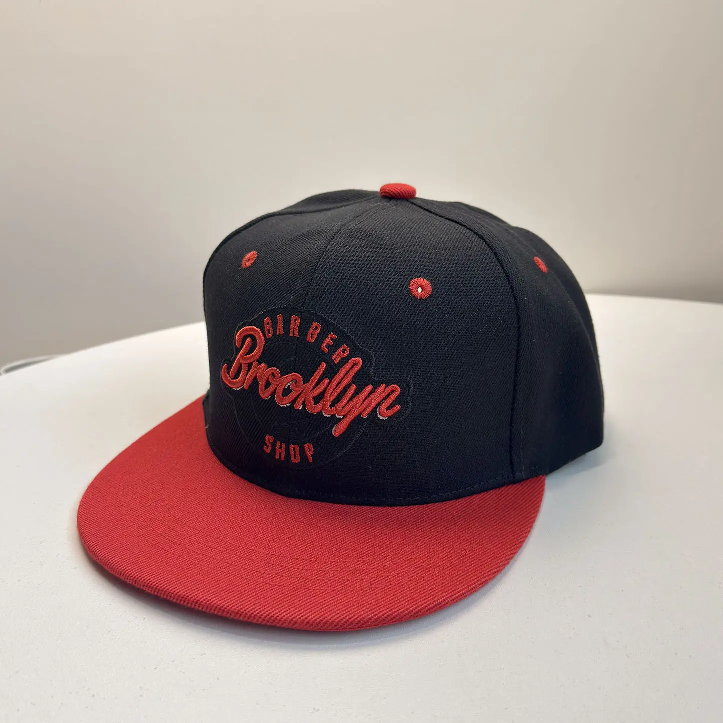 BARBER embroidery in black and red