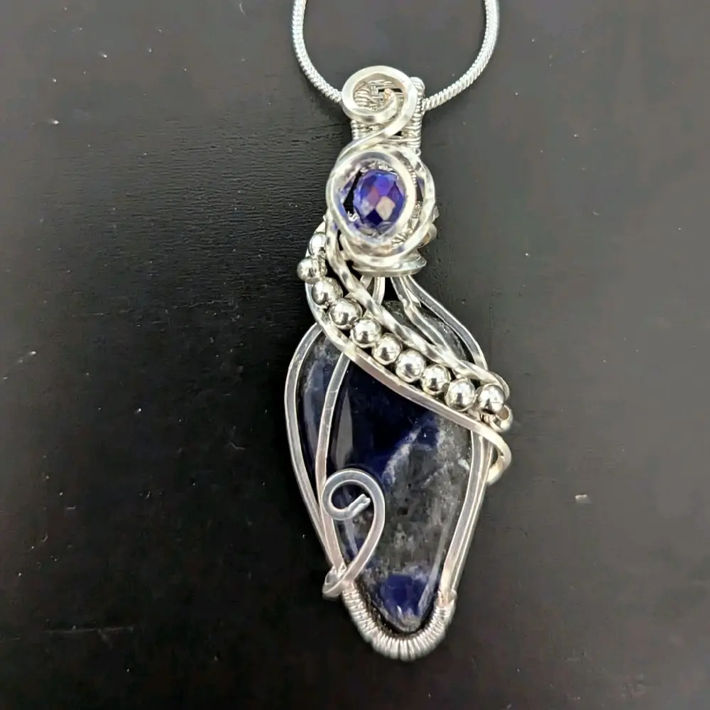 Sodalite Pendant - Wire Wrapped with Non-Tarnish Silver, Featuring a Unique Design and Elegant Style