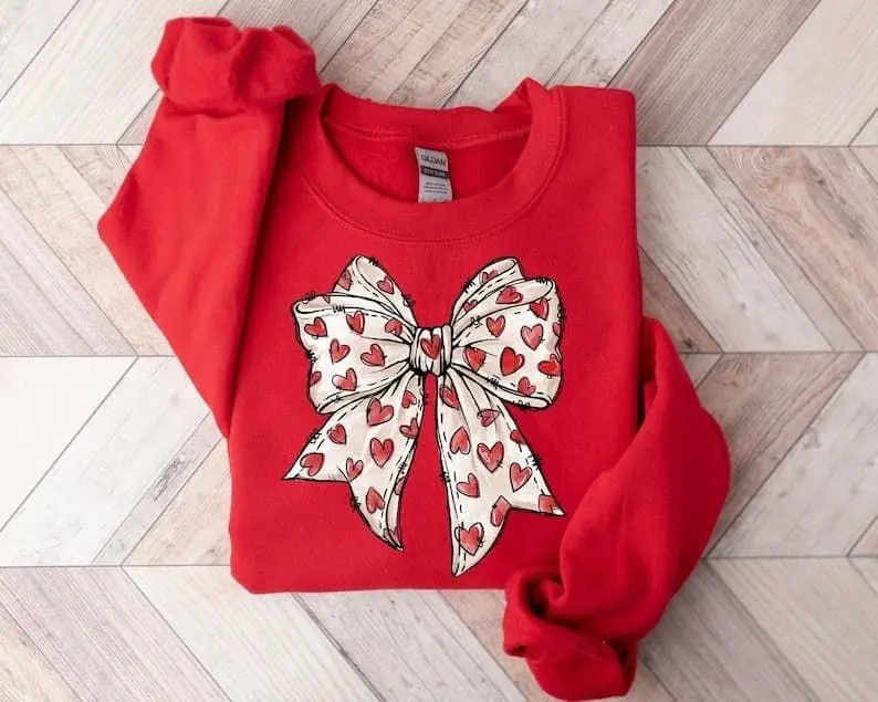 [Sale Up To 50%] Coquette Valentine's Day Heart Bow Sweatshirt, Retro Valentine Shirt, Valentines day Bow Shirt, Coquette Bow Shirt, Bow Valentine Gifts, streetwear graphic tee