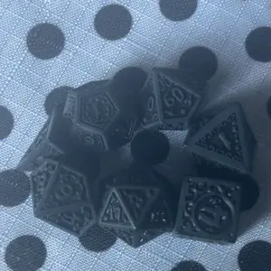 Black Flame (Uninked) | Matte Black Ornate "Magic Flame" Design, Difficult to Read, Uninked | Acrylic Dice Set (7)