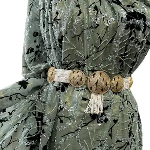 Green fabric with gold metallic sheen and beads