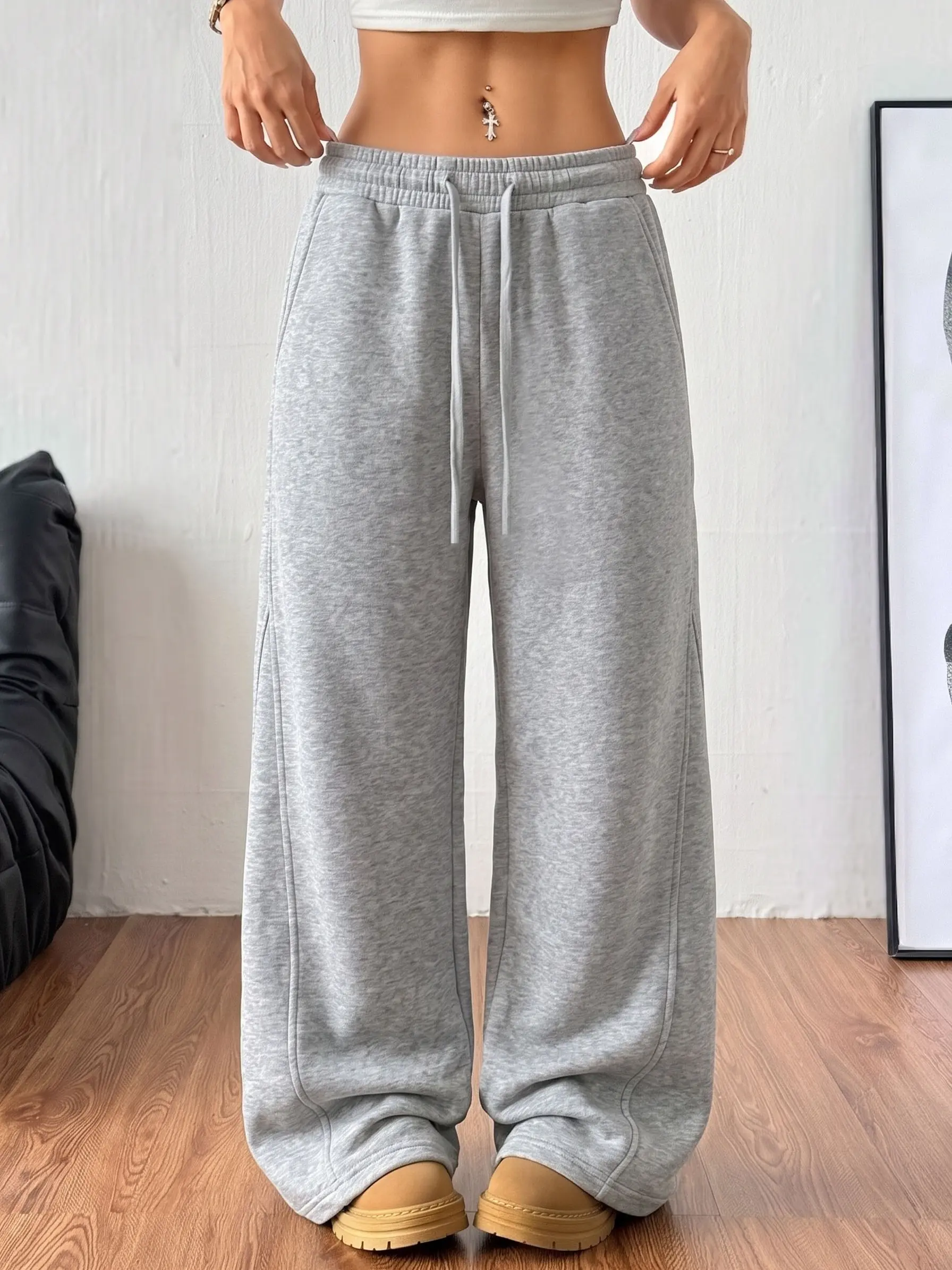 Women’s cotton wide-leg sweatpants with an elastic drawstring waist and side pockets, long length.Loose straight-leg casual pants, lightweight and breathable, suitable for home wear, commuting to work, and everyday wear.