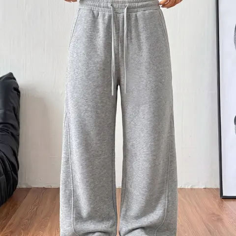 Women’s cotton wide-leg sweatpants with an elastic drawstring waist and side pockets, long length.Loose straight-leg casual pants, lightweight and breathable, suitable for home wear, commuting to work, and everyday wear.