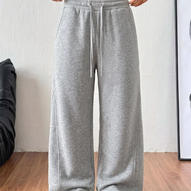 Women’s cotton wide-leg sweatpants with an elastic drawstring waist and side pockets, long length.Loose straight-leg casual pants, lightweight and breathable, suitable for home wear, commuting to work, and everyday wear.