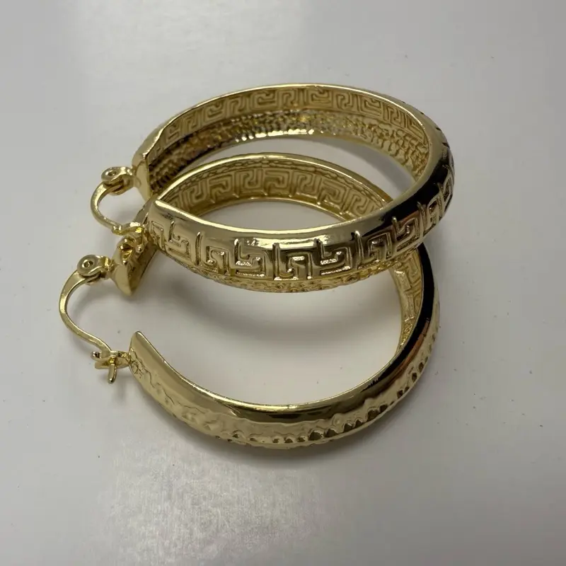 Medium, flat rim earrings with 14 k laminated gold finish and secure closure, hypohalargenic.