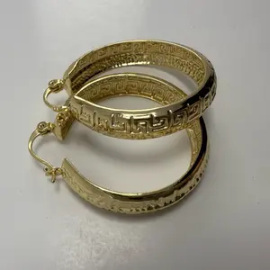 Medium, flat rim earrings with 14 k laminated gold finish and secure closure, hypohalargenic.