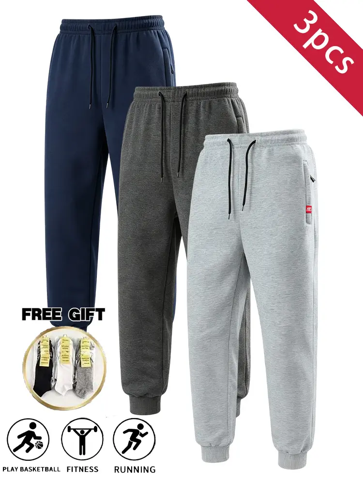 3PCS men’s lightweight fleece jogging pants with elastic drawstring waist, rolled cuffs at the legs, zippered pockets, loose casual fit—suitable for training, running, and fitness; available in multiple colors; includes socks; ideal for everyday streetwea