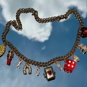 XOXO Pre-Made Steez Gold Plated Stainless Steel 18" Charm Necklace with Assorted Charms Including Dice & Lipstick