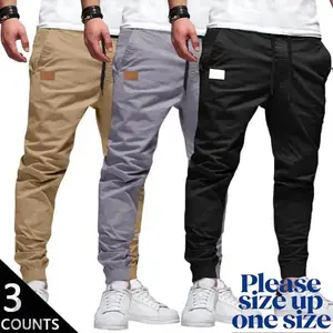 Men’s 3-Pack Casual Jogger Pants – Khaki, Gray & Black – Elastic waistband with drawstring, ribbed cuffs, PU patch detail – Lightweight 100% polyester fabric – Perfect for streetwear, travel, everyday wear – Sizes S–XXL. We recommend choosing one size lar
