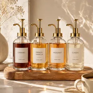 4 Pack Aesthetic Glass Coffee Syrup Dispenser Set with Labels, 16.9oz Coffee Bar Accessories & Station Organizer with Gold Pumps for Syrup, Honey, Sauce