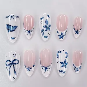 24Pcs Blue Flower Press on Nails Medium Almond French Tip Fake Nails with Bow Design White Glossy False Nails Full Cover Artificial Glue on Nails Spring Summer Stick on Nail for Women DIY Manicure