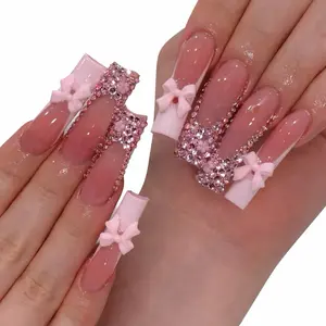 Elegant Pink Nail Art with Glitter and Bow Design for a Chic Look