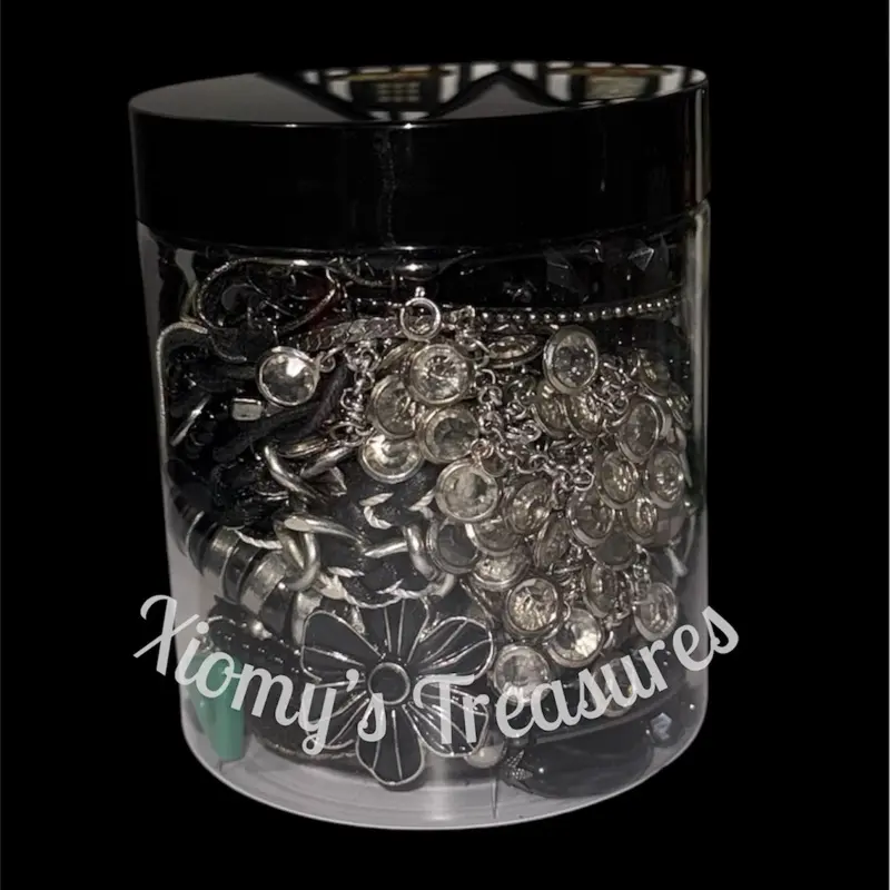 Xiomys Clear Plastic Jewelry Organizer Jar with Lid for Storage and Display Featuring Necklaces Bracelets Bangles Earrings Rings in Mixed Metal Tones