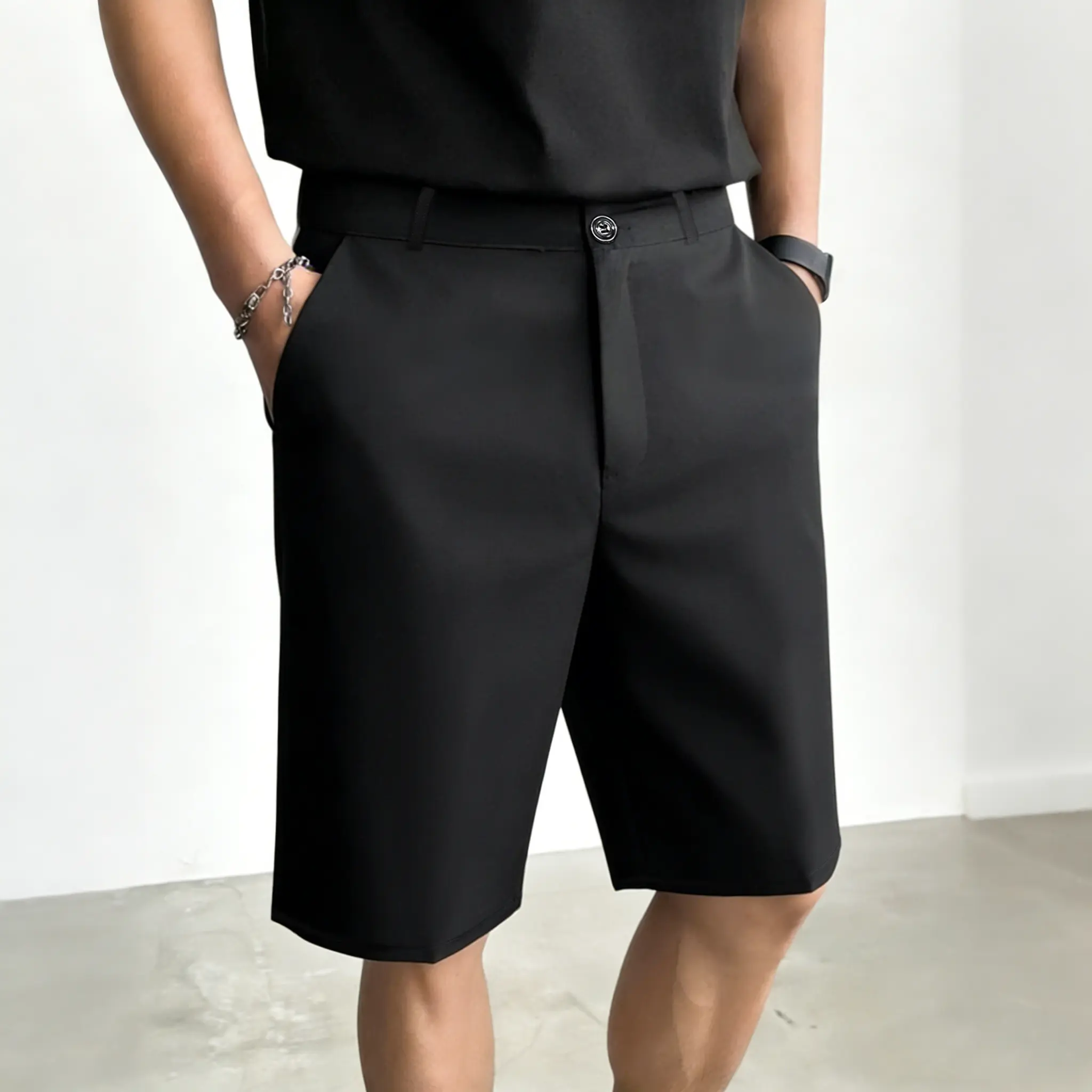 Men’s black suit shorts — loose fit that conceals the hips, drapey mid thigh length (available in sets of three or single pieces).