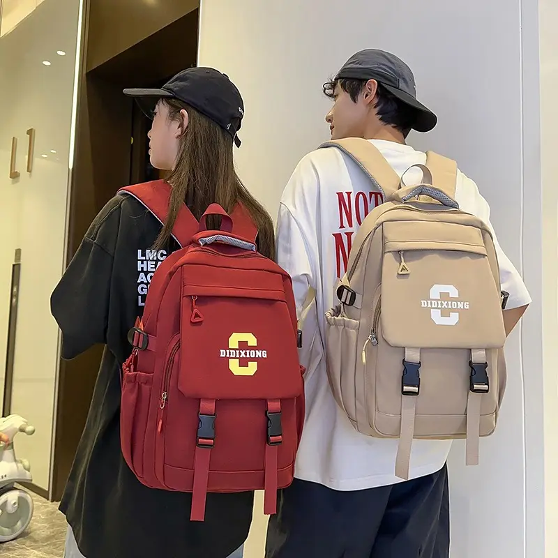 Varsity Style Nylon Backpack with Letter Graphic & Buckle Straps - Lightweight Multi-Pocket Laptop Daypack for Daily Commute