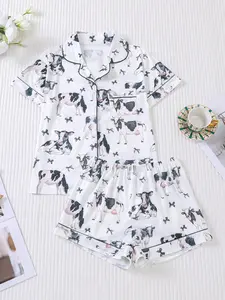 Two piece women's sleepwear set, cow print, knitted fabric, short sleeved button top, matching shorts, sleepwear set, collar and pocket details, women's sleepwear, suitable for women's adult sleepwear set