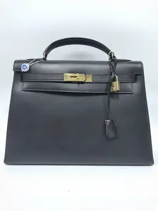 Pre-owned france Clutches & Wristlets Hermès Black and Gold Kelly 32 (SZ 67869)