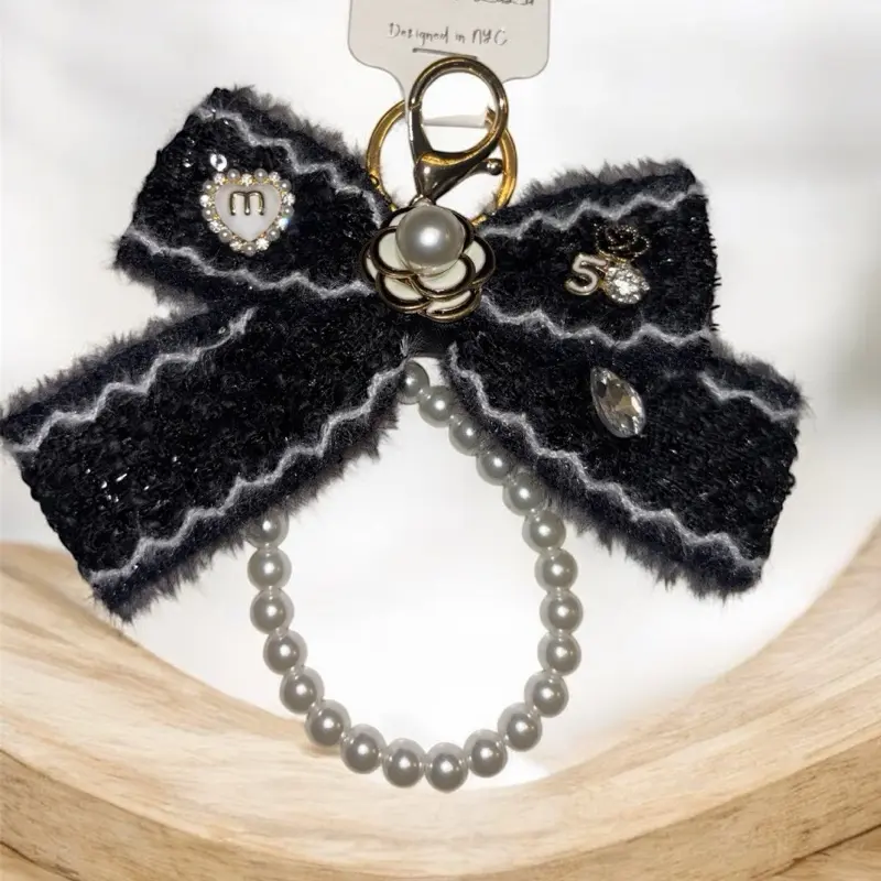 Luxury Pearl Bow Keychain Designer Style Bag Charm with Sequin Accents Faux Pearls Gold Tone Hardware Crystal Details
