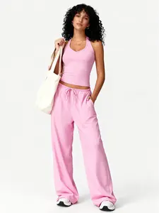 Women’s quick-dry, breathable halter V-neck cropped tank top + high-waisted elastic wide-leg pants two-piece set. Casual sporty spring/summer outfit for everyday workouts, commuting, and versatile wear for multiple occasions.