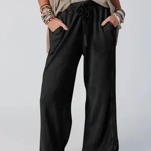 Casual wide-leg sweatpants with a high waist, loose fit, acid wash finish, drawstring, and pockets