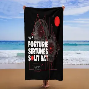 Black background with red geometric patterns and white text; beach towel/beach towel multi-functional use. Absorbent towel