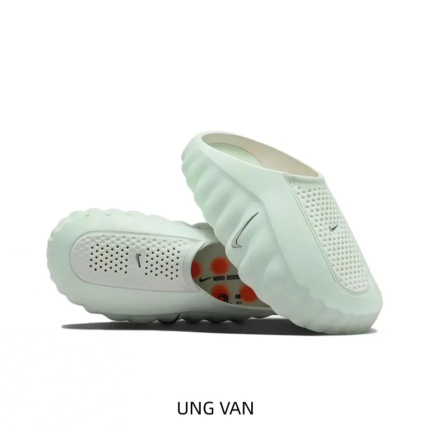 These slip‑on athletic shoes feature fresh mint light‑green molded upper with perforated breathable surface, thick wavy cushioned sole for beach walks and casual home relaxation.