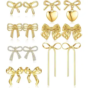 THUNARAZ 7 Pairs Diverse Golden Bow Clip on Earrings Non Piercing Ribbon Long Dangle Drop Tassel Ear Clips for Women Sparkly Jewelry Gift Set for Birthday Music Festivals Parties Important Occasions Christmas Gift