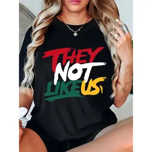 Women’s Black T-Shirt with Bold Red White Green Yellow “THEY NOT LIKE US” Graphic – Casual Streetwear for Daily, Parties, Concerts, Trendy Statement Top for Fashion-Forward Women