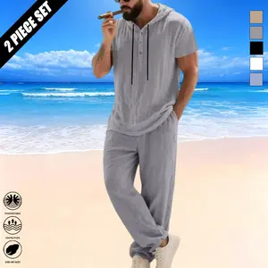 Men’s spring/summer linen casual two-piece set featuring a loose American-style hooded short-sleeve Henley shirt and long pants, suitable for everyday wear and beach outings.