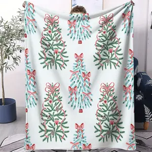 A digital printed blanket with a combination of Christmas tree and bow pattern, creating a warm and comfortable festive atmosphere, perfect for bedroom holiday decoration blankets in homes. A single-sided printed blanket